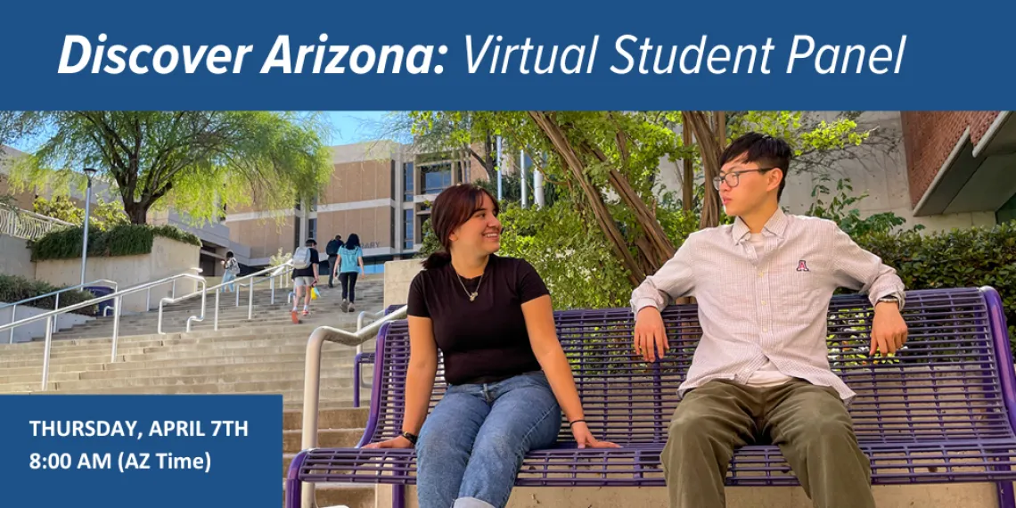 Two students sitting on a bench on campus