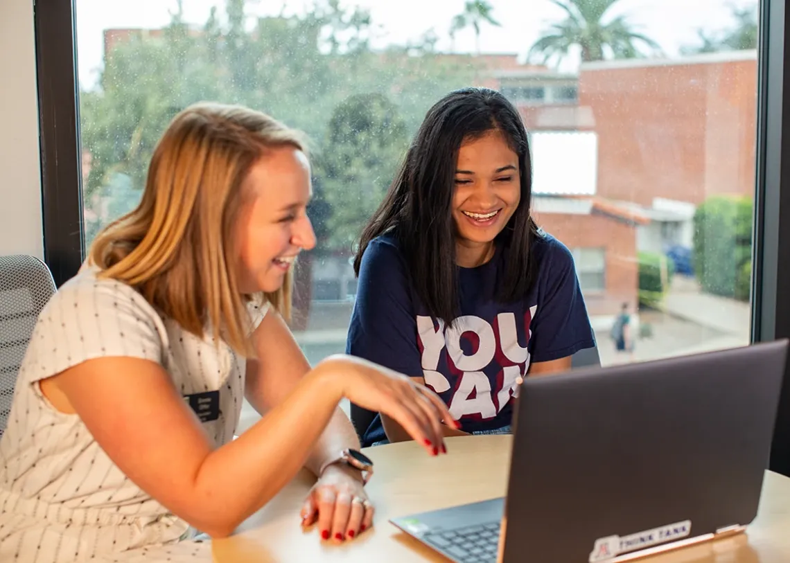 Students with a laptop